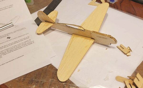The completed P-40 ready for balancing with the provided clay. I’ll admit the delicate parts representing the canopy rails got the best of my fat fingers, but you could just leave them in for a more durable airframe.